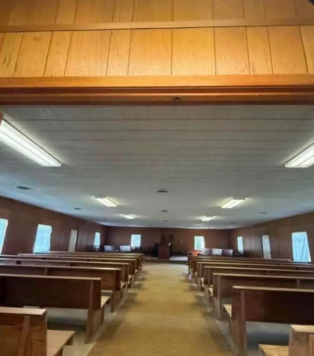 Sanctuary after: refreshed room with pews reset in place
